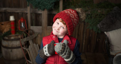 Little boy with hat and glove and hot chocolate