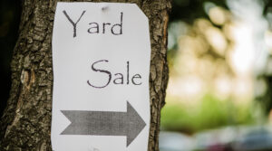 Yard sale sign on tree